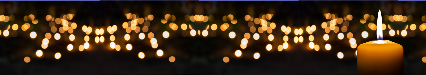 alt="row of lit candles"