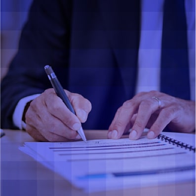 Close-up of funeral professional signing legal compliance documents