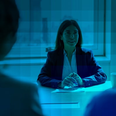 Funeral home recruiter interviewing candidates in office setting.