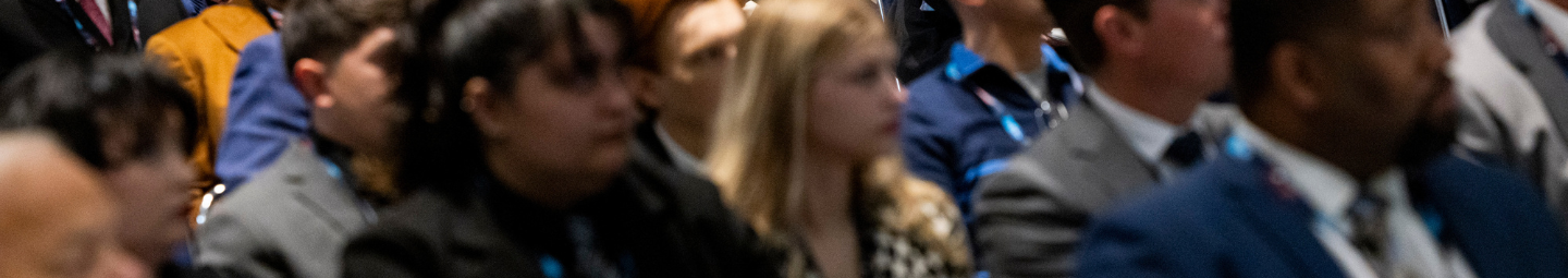 People attentively attending an educational presentation.