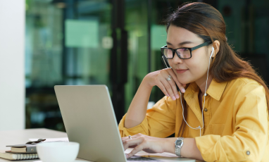 Woman using a laptop.